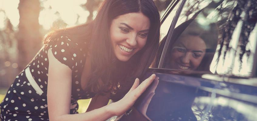 Paintless Dent Repair Woman Admiring Fix